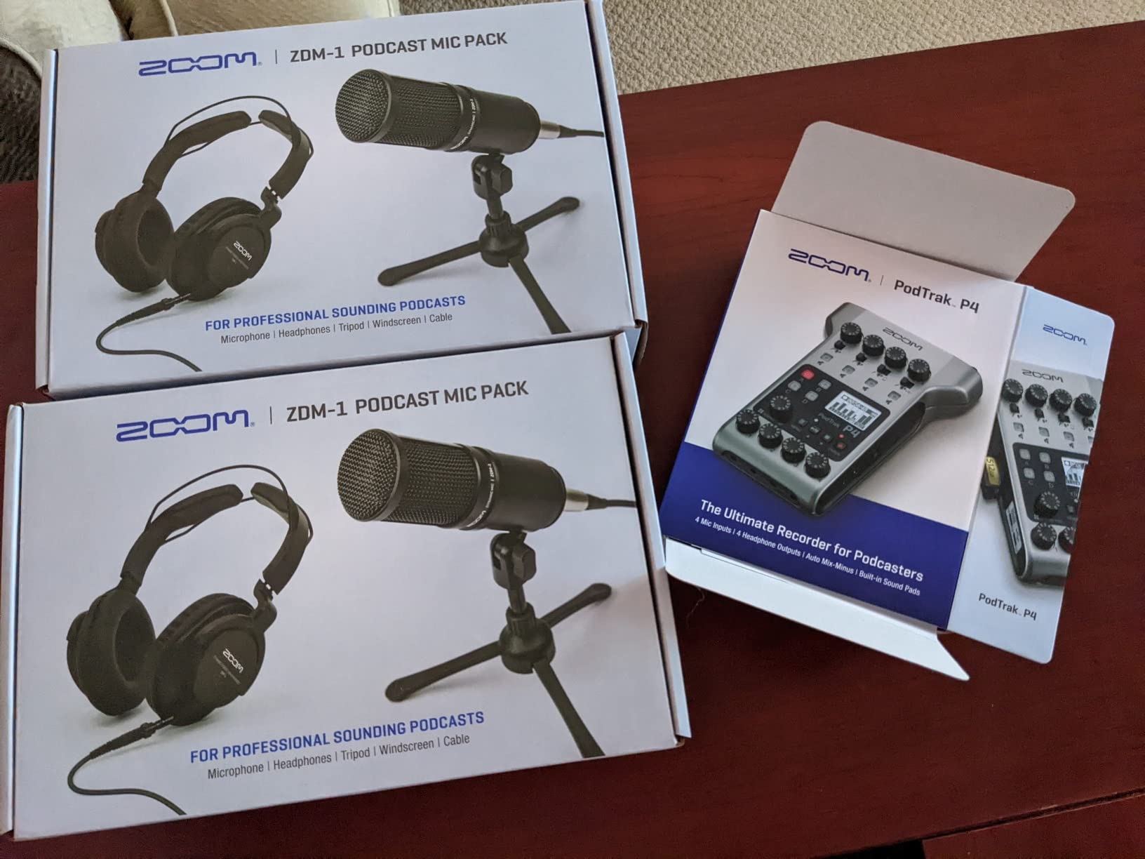 Zoom PodTrak P4 Portable Multitrack Podcast Recorder + 4X Zoom M-1 Mic + 4X Headphones + Windscreens + XLR Cables + 4X Tabletop Stand + Cloth – 4 Person Podcasting Mic Pack Bundle customer photo 1