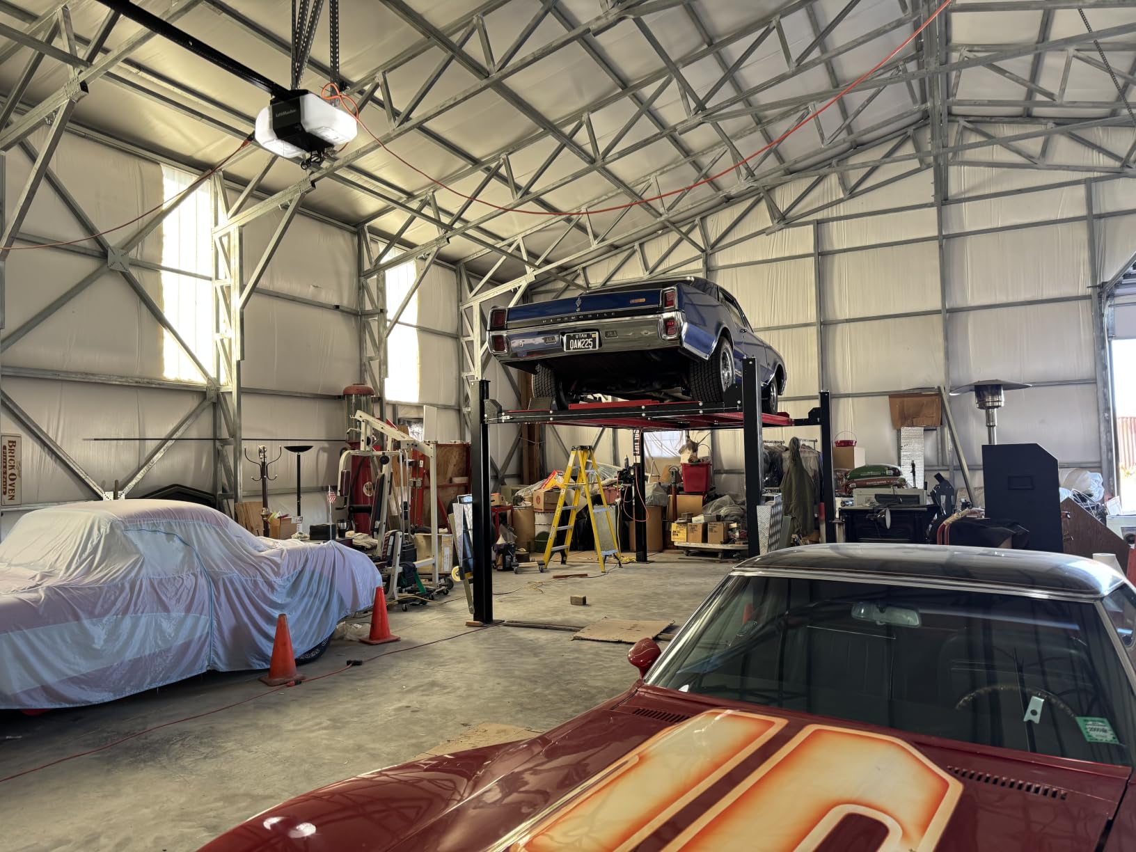 KT-4H110 11,000 Lbs 3.0HP 110V 4 Post Car Lift Heavy Duty Four Post Parking Storage Service Car Lift，84.5” Max Height Extra Tall Extra Wide Hydraulic System customer photo 1